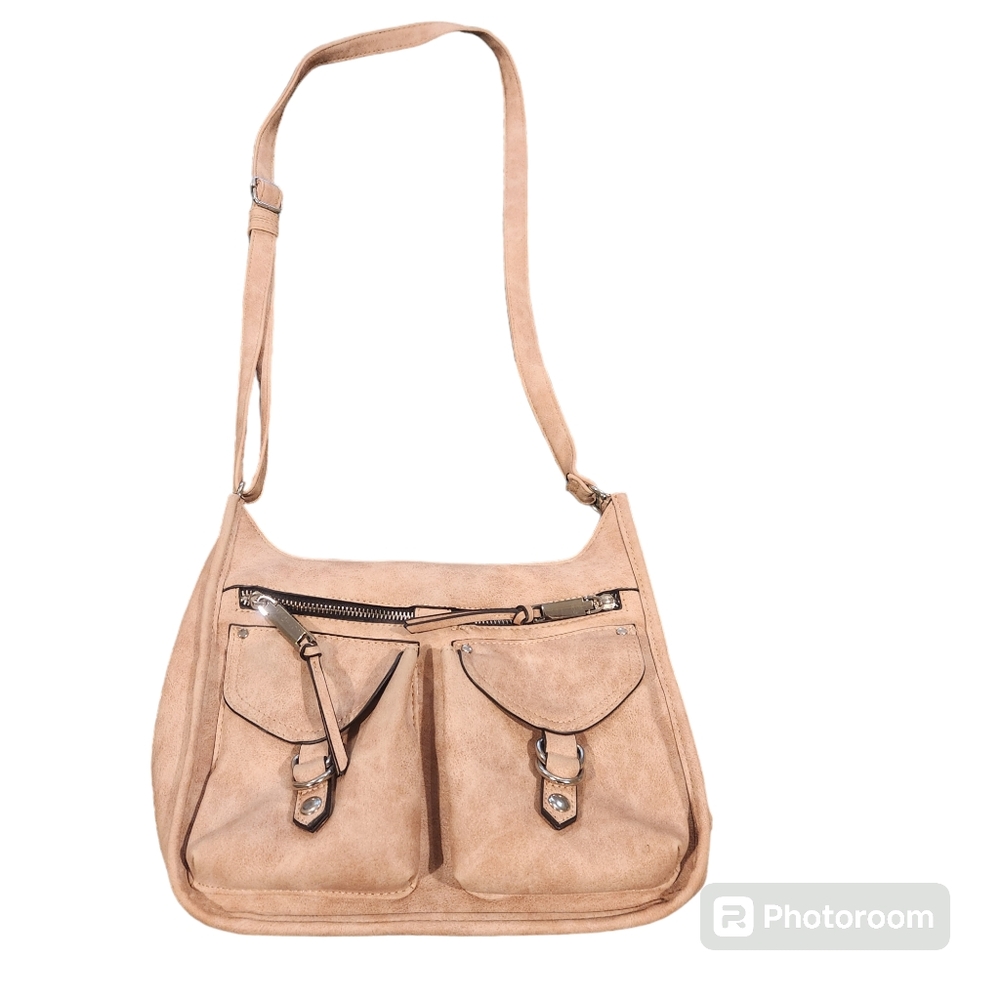 Tan purse with two pockets on the front. Three inside pockets. Zipper on…